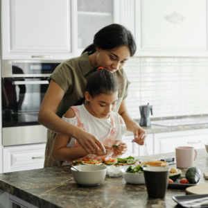 Mary the Mom cooking with her son